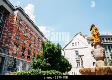 National and University Library of Slovenia and Fountain of Neptune in Ljubljana, Slovenia Stock Photo