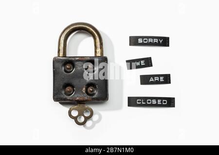 Padlock with label sorry we are closed isolated on white background. Closed by coronavirus or covid-19 concept Stock Photo