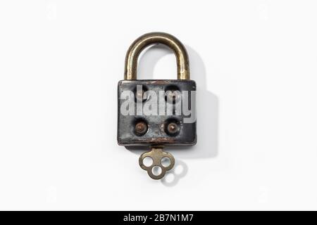 Antique padlock isolated on white background. Closed concept Stock Photo