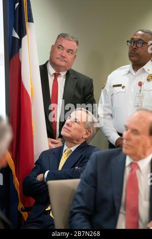 San Antonio, Texas, USA. 16th Mar, 2020. Governor GREG ABBOTT watches a video as he gives an update to Texas' coronavirus pandemic response at a meeting of state leaders in San Antonio's Emergency Operations Center (EOC). Abbott confirmed the first coronavirus-related death in Texas later in the day. Credit: Bob Daemmrich/ZUMA Wire/Alamy Live News Stock Photo