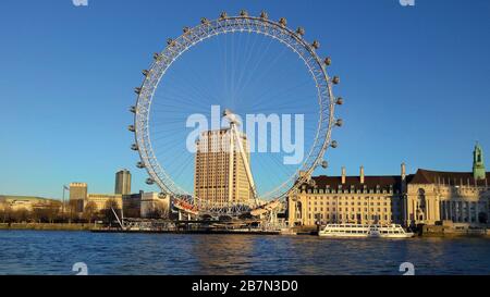 London, UK - January 15, 2016: Ferris wheel named London Eye, landmark and tourist attraction on river Thames Stock Photo