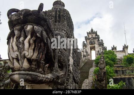 Monster face with fangs in front of the entrance of the Pura Penataran Agung Lempuyang. Bali Indonesia