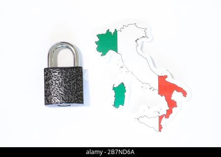 Italy national flag with outline on a white background with a closed lock top view. The concept of closing the borders of the country. Country Stock Photo