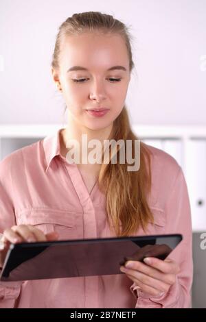 Pretty woman using modern gadget Stock Photo