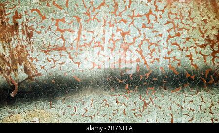 Rusted blue painted metal wall. Detailed photo texture. Close-up detail of cracked paint on rusty metal wall. Stock Photo