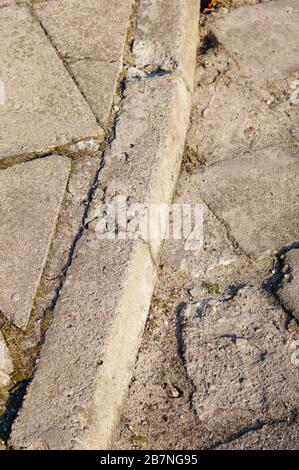 Closeup shot of weathered sidewalk edge pavement Stock Photo