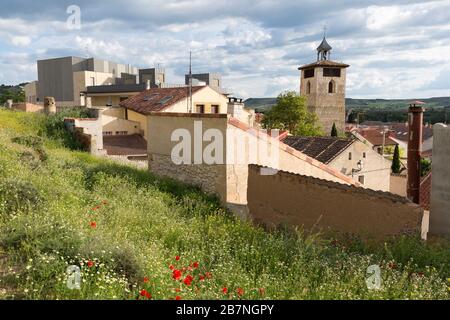 View of the village of Peñafiel with the Torre del Reloj in Castile and León, Spain. The landmark tower was built in 1086 as part of the Romanesque Ig Stock Photo