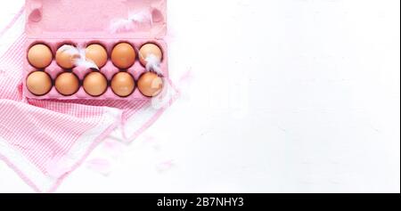 Eggs in a box on a white background. Easter concept. Delicate colors and plenty of room for text. Copy space Stock Photo