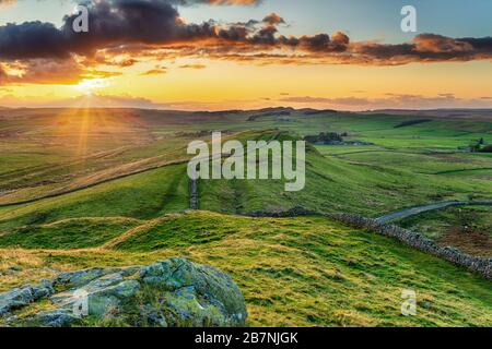 Sunset over Caw Gap on Hadrians Wall near Haltwhistle in Northumberland Stock Photo