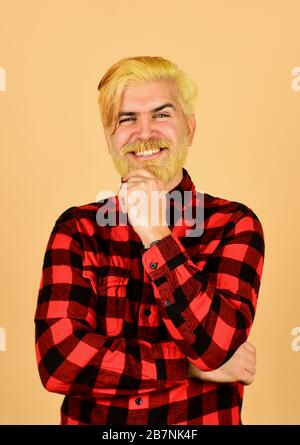 Expression of inner you. Moisturise and apply beard oils. Handsome man unshaven face. Bearded man checkered shirt. Hipster dyed beard. Hairdresser and barbershop. Coloring beard. Fashion trend. Stock Photo