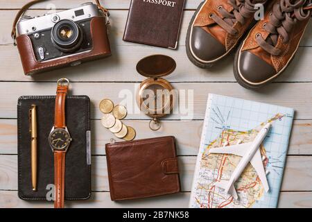 Set of traveler essentials on wooden background. Travel and adventure concept Stock Photo