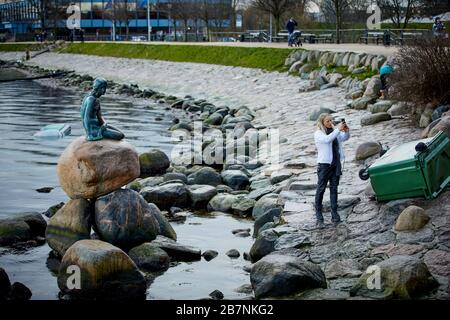 Copenhagen, Denmark’s capital, Bronze statue of The Little Mermaid at Langelini promenade by Designer Edvard Eriksen Copenhagen, Denmark’s capital, Bronze statue of The Little Mermaid at Langelini promenade by Designer Edvard Eriksen