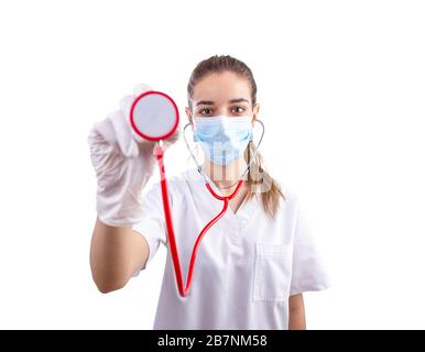 Young female doctor holding a stethoscope in a front view shot Stock Photo