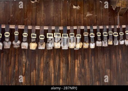 A collection of old cowbells at the stable of the guesthouse Besler's Schwand close to Obersdorf/Allgaeu. Stock Photo