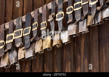 A collection of old cowbells at the stable of the guesthouse Besler's Schwand close to Obersdorf/Allgaeu. Stock Photo