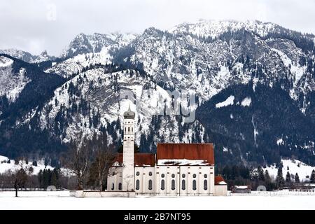 The church St. Coloman close to Schwangau in front of the Ammer mountains. Stock Photo