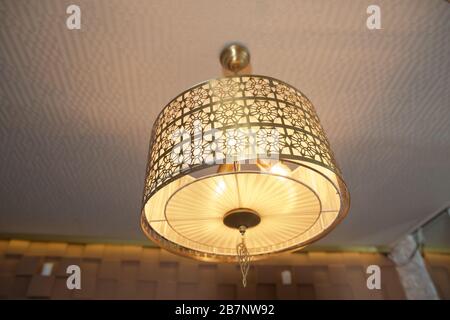 Modern 3-Light Led yellow Chandelier. Pendant Sconce Lighting Lamp . Ceiling Light Oval Pendant Light Fixture. Hanging Lights with Creme Fabric Shade. Stock Photo