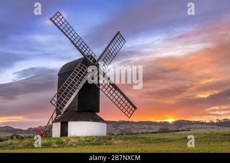 Ivinghoe, Buckinghamshire, England. Tuesday 17th March 2020. UK Weather. After a cold night, the dawn sky is spectacular over the Pitstone Windmill in Stock Photo