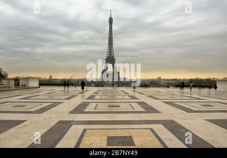 PARIS, FRANCE - 17 MAR 2020: France ordered lockdown in Covid-19 battle, Trocadero square, in front of Eiffel tower, usually crowded are almost empty. Stock Photo