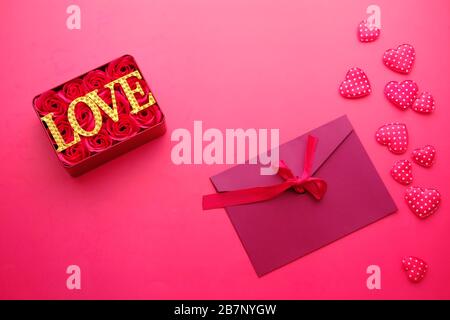 top view of gift box, envelope on red background  Stock Photo
