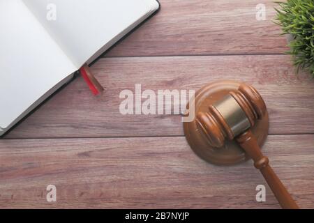 top view of gavel and book on wooden table  Stock Photo