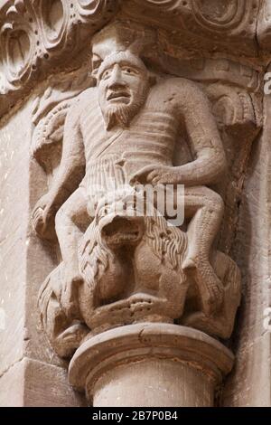 The devil riding an infernal lion with two bodies and one head - Capital (12th century) - St. Peter's Cathedral - Geneva Stock Photo