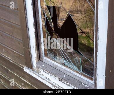 Burglary window pane vandalism background Stock Photo