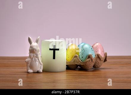 Ceramic Easter Bunny, Candle and Decorated Eggs Stock Photo