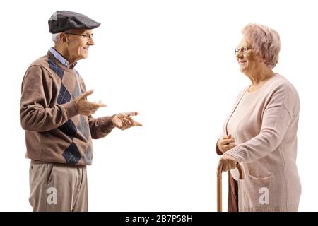 Elderly man and woman standing and talking isolated on white background Stock Photo