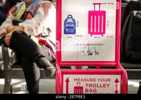 Trolley bag measurements inside an airport. Stock Photo