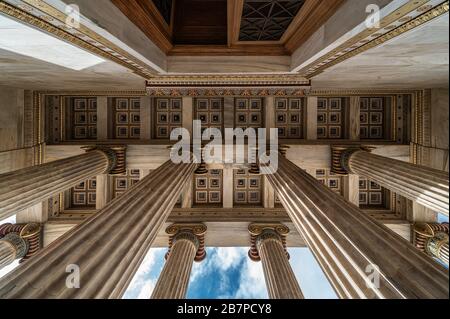 Athens Old Town, Attica/ Greece - 12 28 2019: View over the pilars and ceiling at the entrance of the Academy Athens Stock Photo