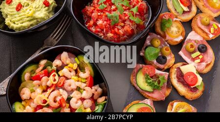 Shrimp salad and sandwiches and other snacks. View from above Stock Photo