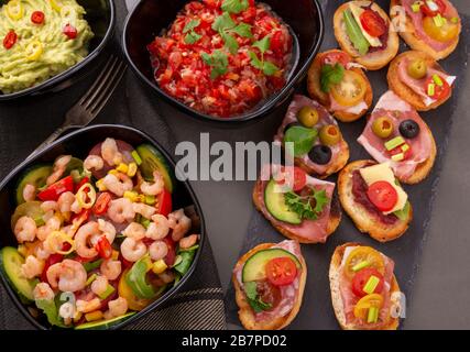 Shrimp salad and sandwiches and other snacks. View from above Stock Photo