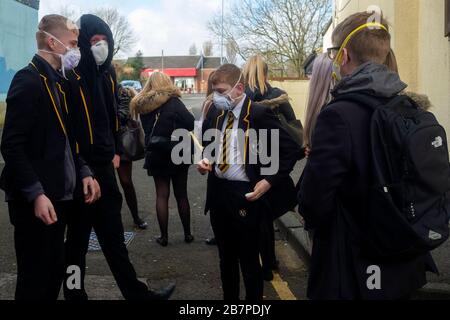 School children wearing face masks make their way to Park View School, Chester le Street, Durham, UK on 17th March, 2020. Stock Photo