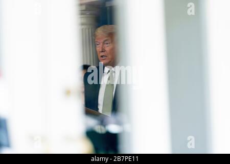 Washington, District of Columbia, USA. 17th Mar, 2020. President DONALD TRUMP seen through the press briefing doors during the Coronavirus Task Force White House Briefing, March 17, 2020 Credit: Douglas Christian/ZUMA Wire/Alamy Live News Stock Photo