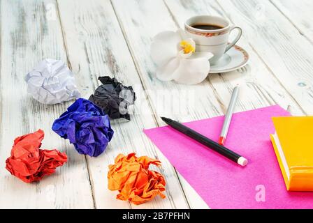 concept - no idea, Empty notebook on wooden table with crumpled papers around Stock Photo