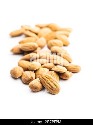 Dried almonds nuts isolated on white background. Stock Photo