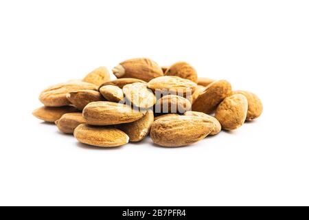 Dried almonds nuts isolated on white background. Stock Photo