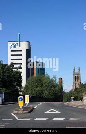 Jurys Inn hotel on left with Derby Cathedral on right in Derby, England Stock Photo