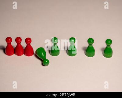 Social distancing concept showing how it can stop spreading of corona virus pandemic. Game stone concept illustrating epidemic safety. Keep the Stock Photo