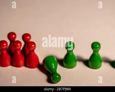 Social distancing concept showing how it can stop spreading of corona virus pandemic. Game stone concept illustrating epidemic safety. Keep the Stock Photo