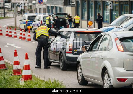 Kehl, Germany - Mar 16, 2020: Polizei officer of the Federal Police checks UK car at the border crossing in Kehl from France Strasbourg during crisis measures in fight against the novel coronavirus Stock Photo