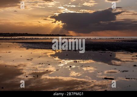 sunset and sun rays at dusk in Margate Stock Photo