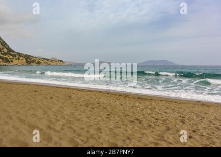 A calm sea is beautiful emerald color and the sandy beach. Crimea, Novy Svet village in the offseason Stock Photo