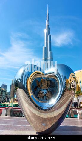 Dubai, UAE - January 30, 2020: Dubai Steel Heart - Modern sculpture near Burj Khalifa building and Dubai Mall, United Arab Emirates