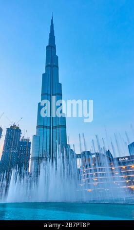 Dubai, UAE - February 02, 2020: The Dubai Fountain and The Burj Khalifa building at twilight