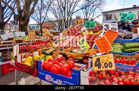 Faenza, Italy - February 27, 2020:  Market stall with various fruits with price tags at street market in Faenza in Italy Stock Photo