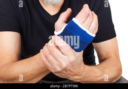 Close up picture of blue orthopedic bandage on injured wrist Stock Photo