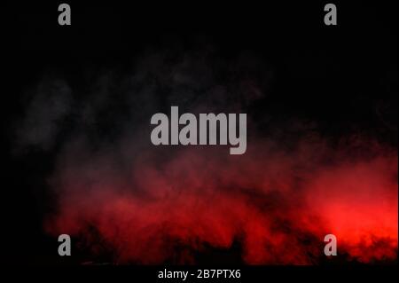 Red smoke isolated on black background Stock Photo