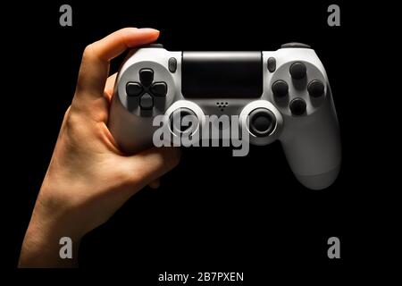 Hyman hand video game gamepad in neon lights isolated on a black ...